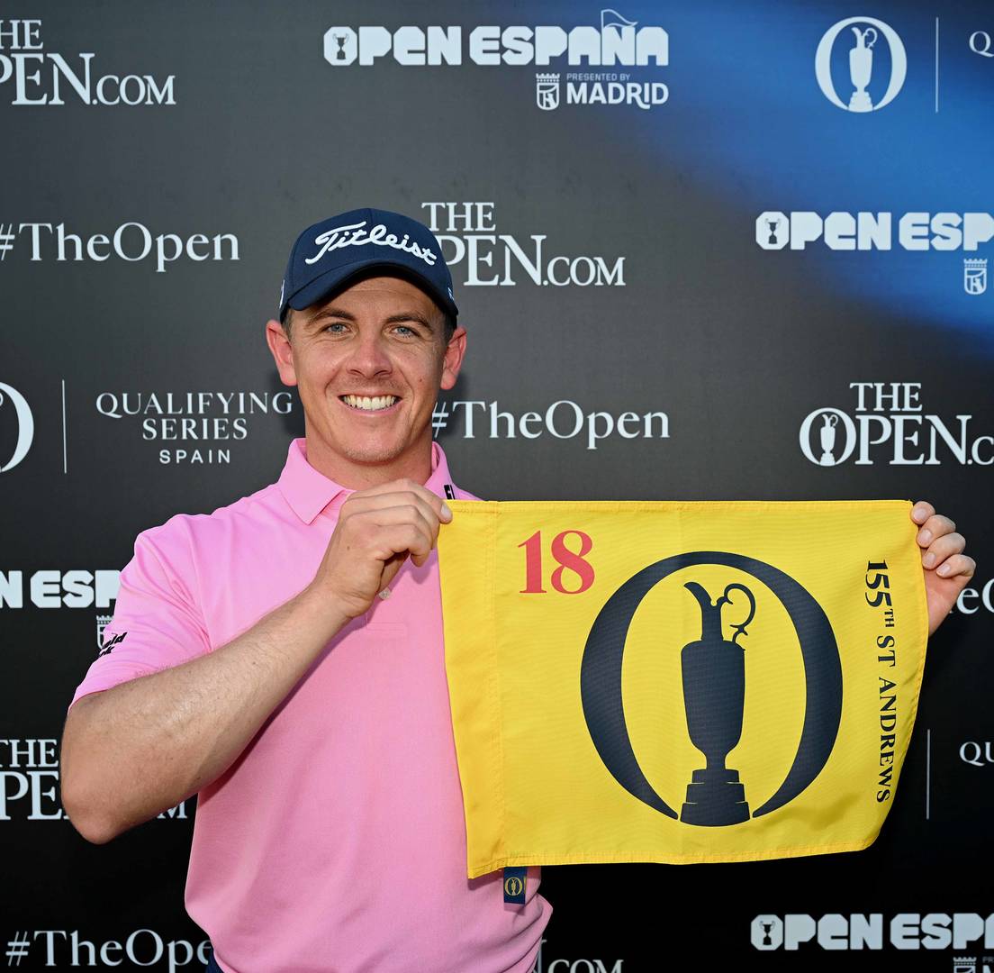 Grant Forrest poses with an Open pin flag after qualifying for The 155th Open at St Andrews.